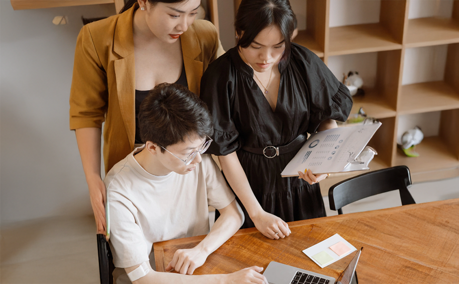 employees reviewing standardized contracts