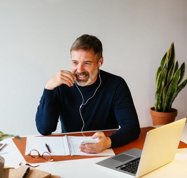 man at desk reviewing types of contracts